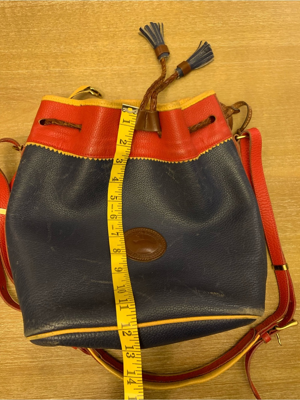 Dooney & Bourke Navy, Red & Yellow Leather Drawstring Bucket Bag - Picture 14 of 16